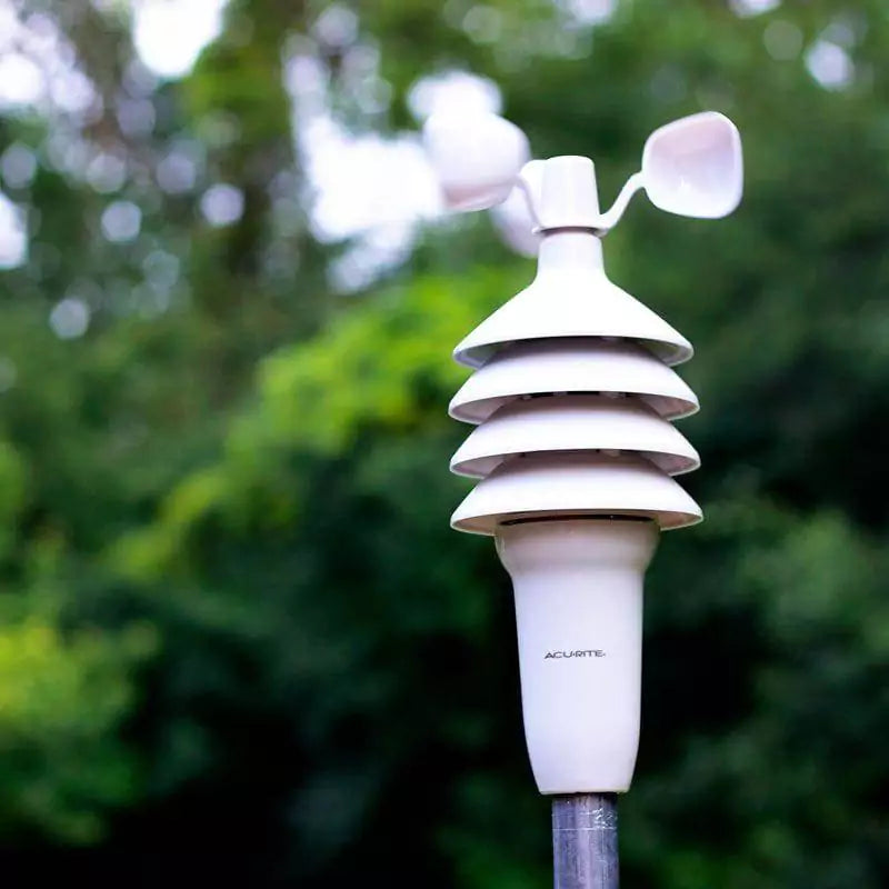 Acurite 3 in 1 weather station mounted on a pole outside