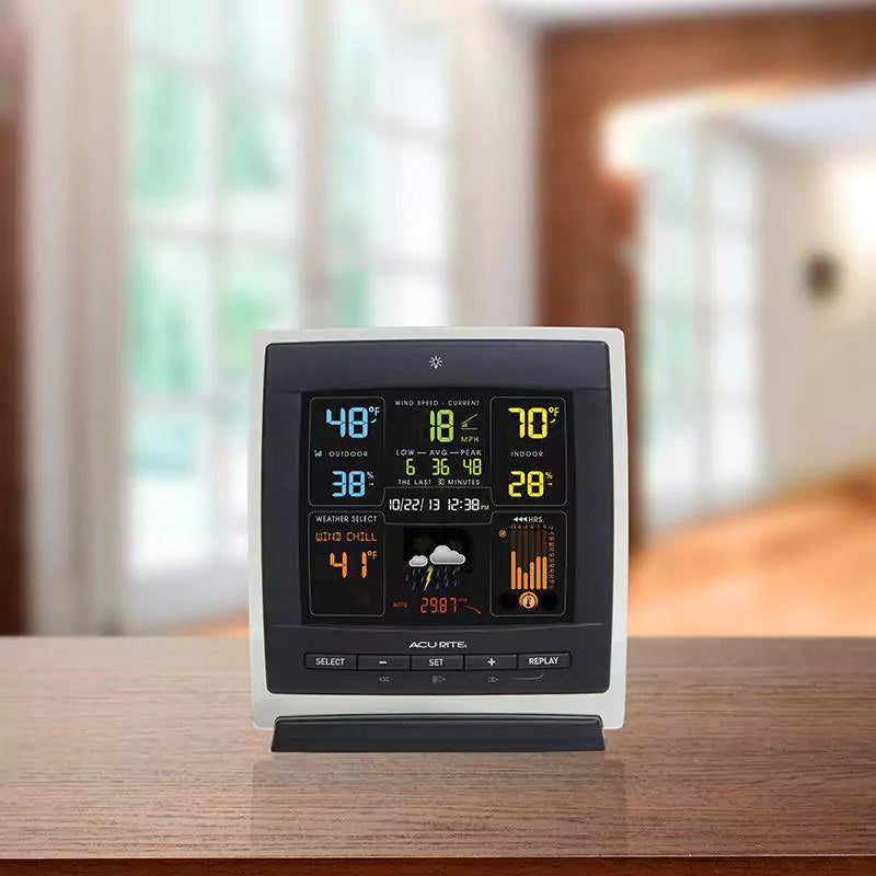 acurite 3 in 1 color display for weather monitoring placed on a table indoor