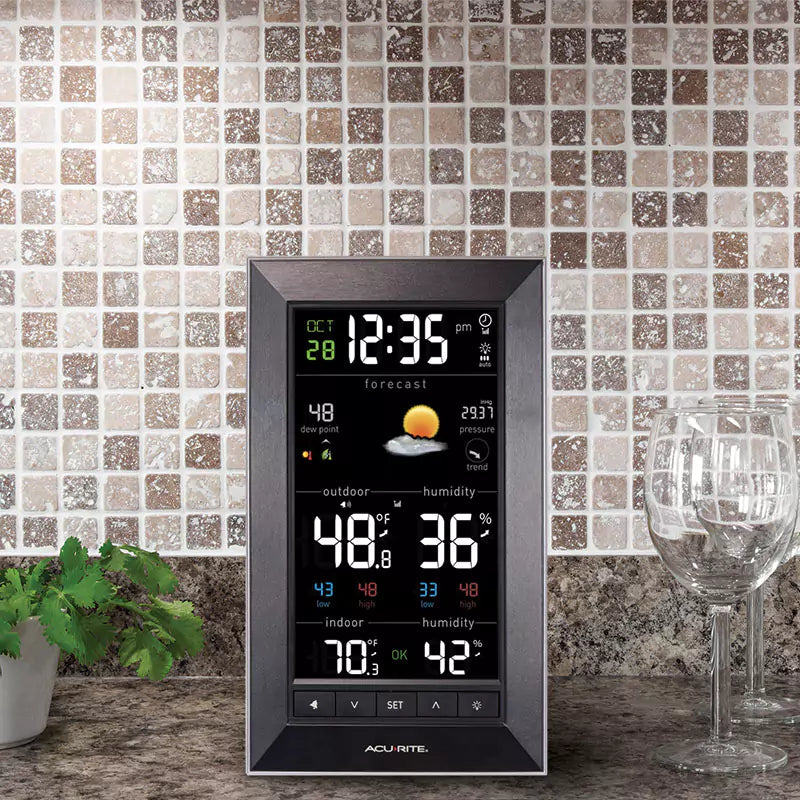 AcuRite weather display showing indoor and outdoor temperature with humidity readings