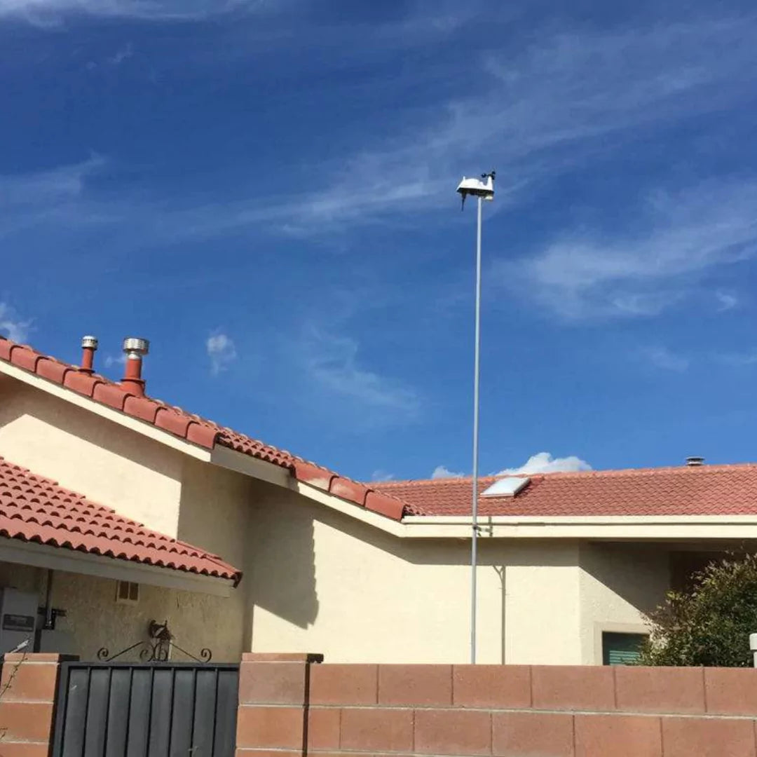 Davis Vantage Vue station mounted on home rooftop for optimal weather data accuracy