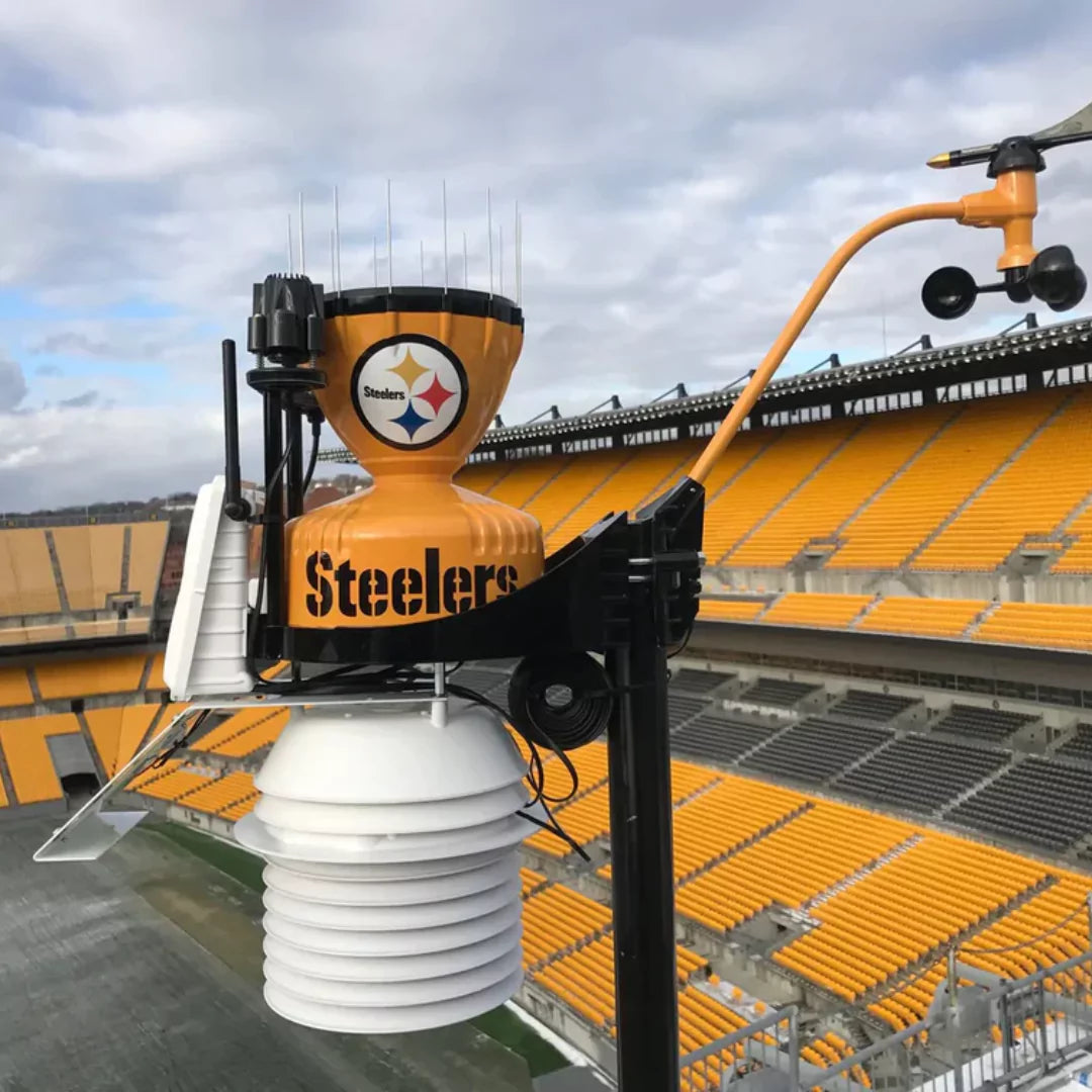 Davis weather station customized with Steelers branding, mounted in a stadium.