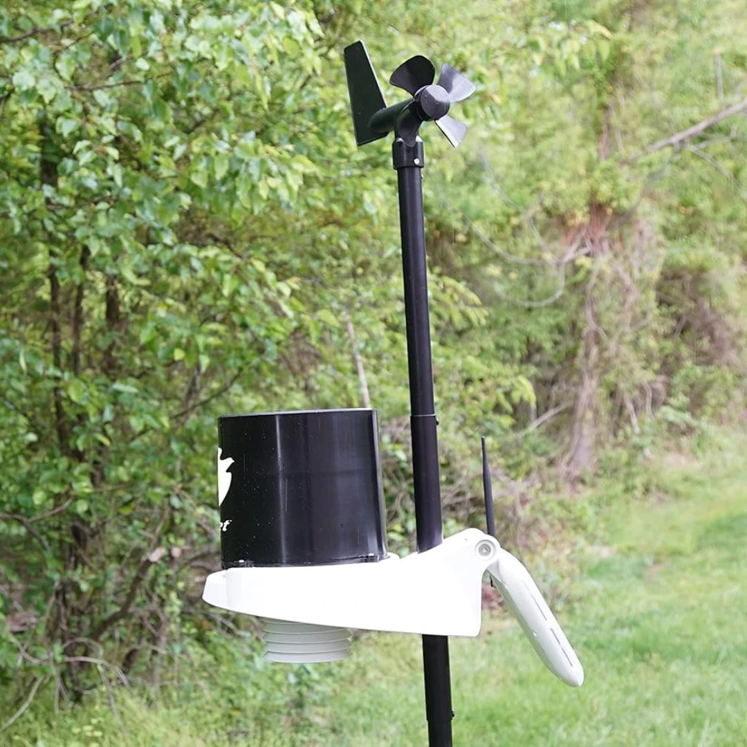 Side view of KestrelMet 6000 weather station installed on a pole in a grassy area