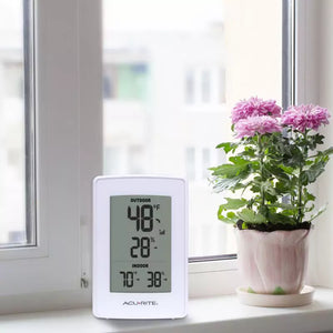 Acurite digital thermometer placed near the window