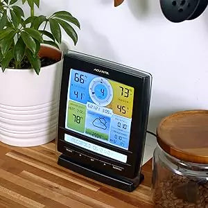 Acurite 5-in-1 display console placed on a table display weather conditions