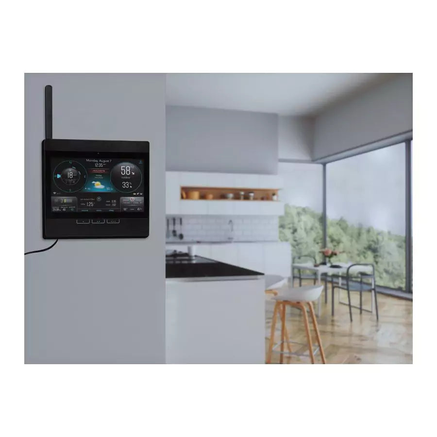 Acurite atlas Wi-Fi display mounted on a wall near the kitchen