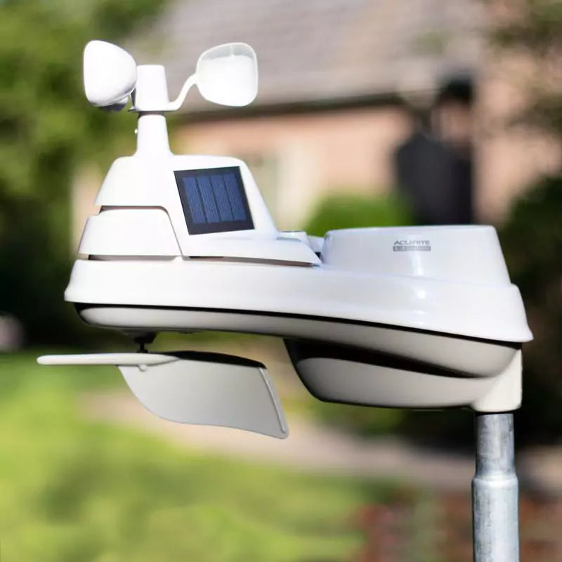 Acurite 5-in-1 weather station mounted outside on a pole