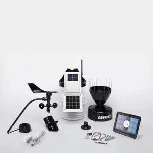 Unassembled Davis weather station components including console, sensors, and hardware.