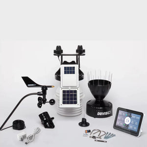 Unassembled Davis weather station components including console, sensors, and hardware.