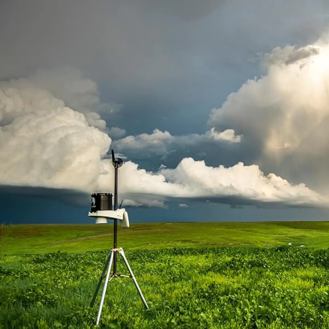 KestrelMet 6000 Weather Station on tripod in field under stormy sky