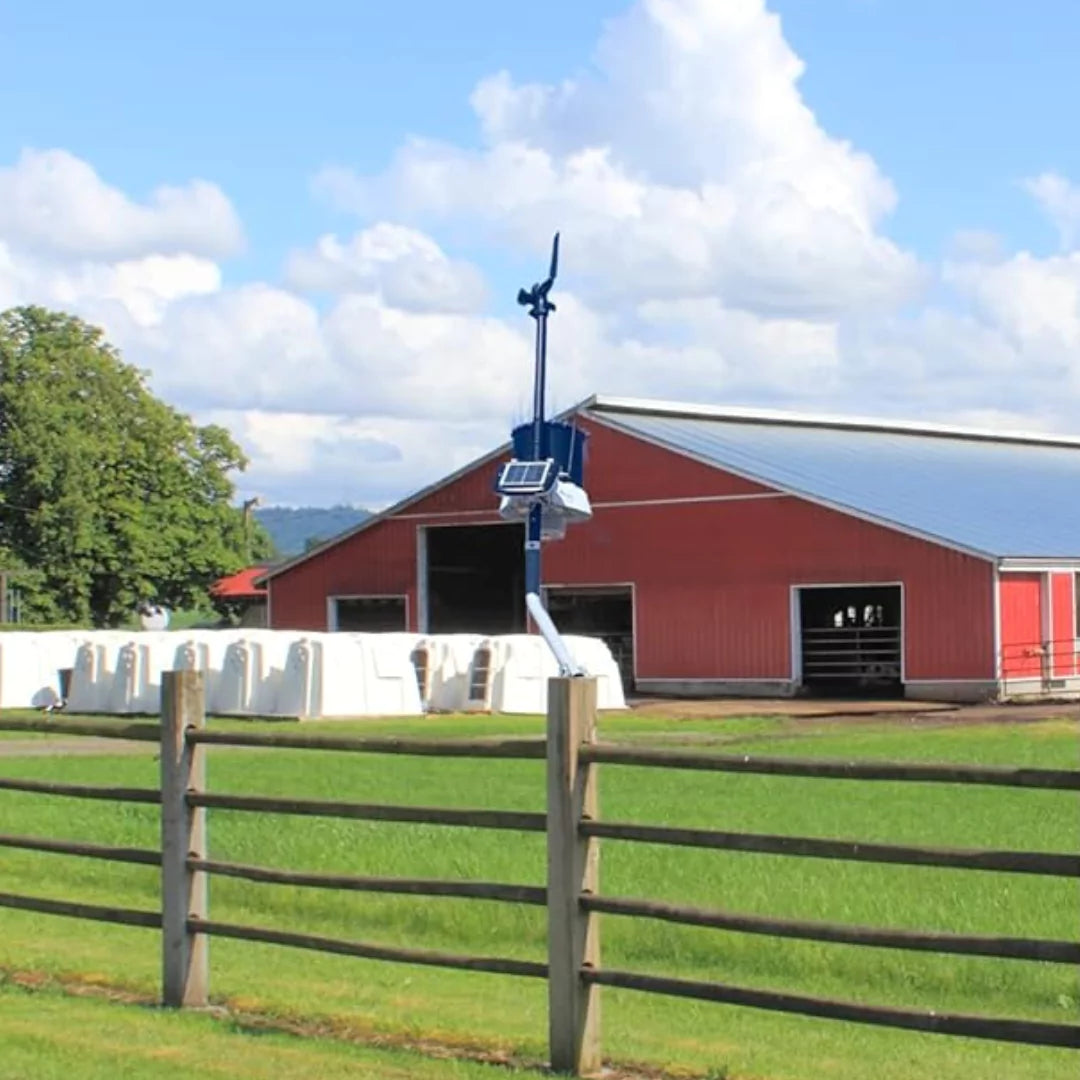 KestrelMet 6000 weather station setup at farm near red barn under clear skies