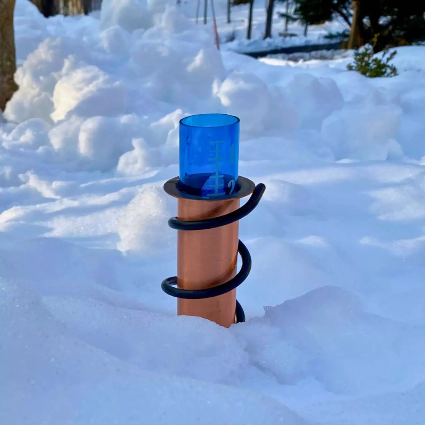 Worlds coolest rain gauge placed in the snow field