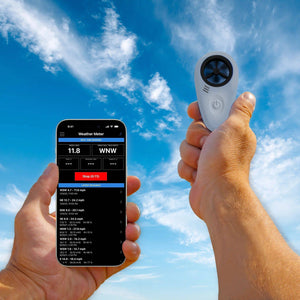 Tempest WINDmeter, anemometer on the hand and smartphone showing wind speed and direction